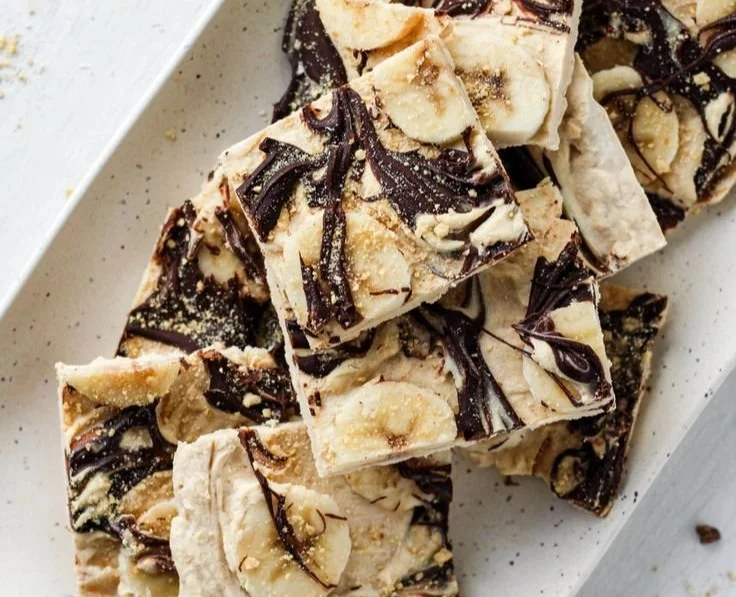 Peanut Butter Chocolate Yogurt Bark topped with nuts and chocolate chips