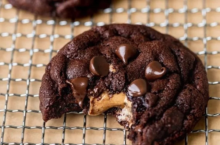 Stuffed chocolate peanut butter cookies with gooey filling and chocolate chunks.