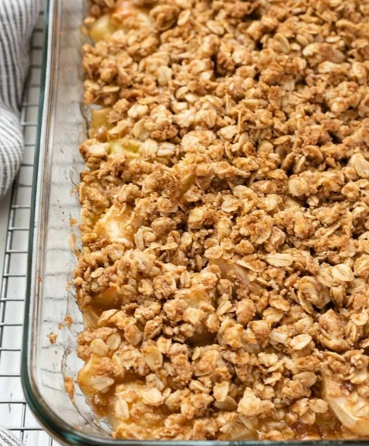 Easiest apple crisp with baked apples and crumb topping served in a dish